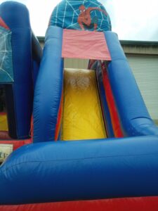 Super hero bounce house combo slide